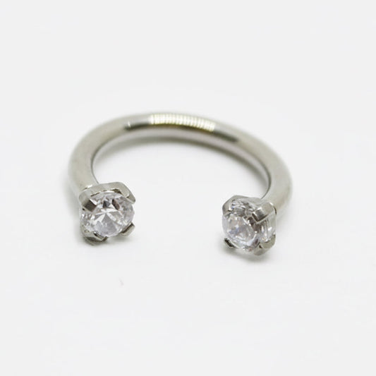 piercing fer à cheval titane argenté zircons cubiques sertis griffes vissage interne 1.2mm