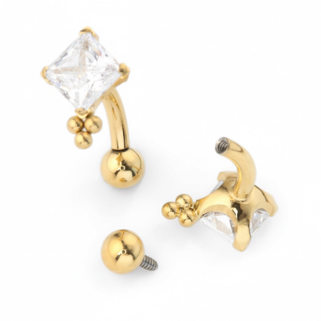 micro banane piercing titane doré PVD gold zircon carré taille princesse vissage interne 1.2x10mm